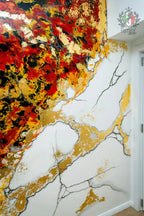 Venetian stucco wall with gold and black crack accents
