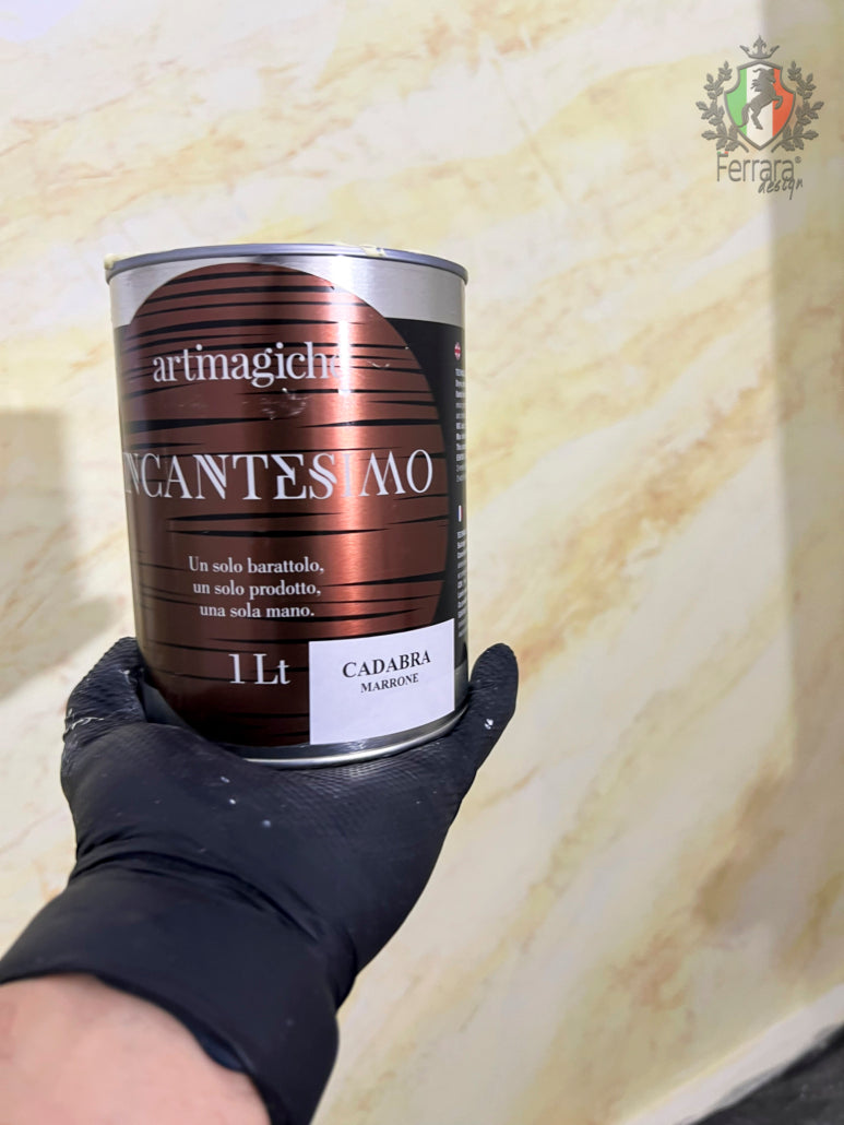 Can of artimagich Incantesimo with a gloved hand holding it against a textured beige background
