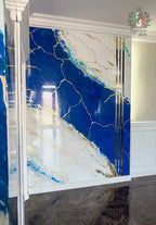 Blue and white Venetian stucco wall with gold accents and stripes