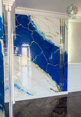 Blue and white Venetian stucco wall with gold accents and stripes