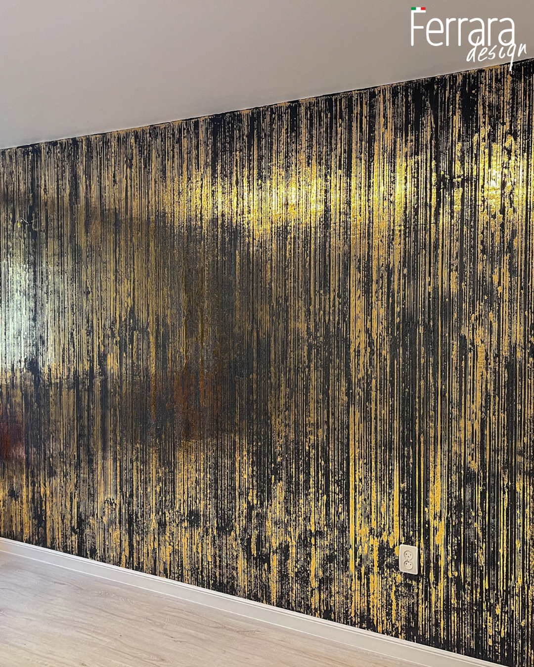 Textured wall with gold and black pattern, featuring Ferrara design logo.