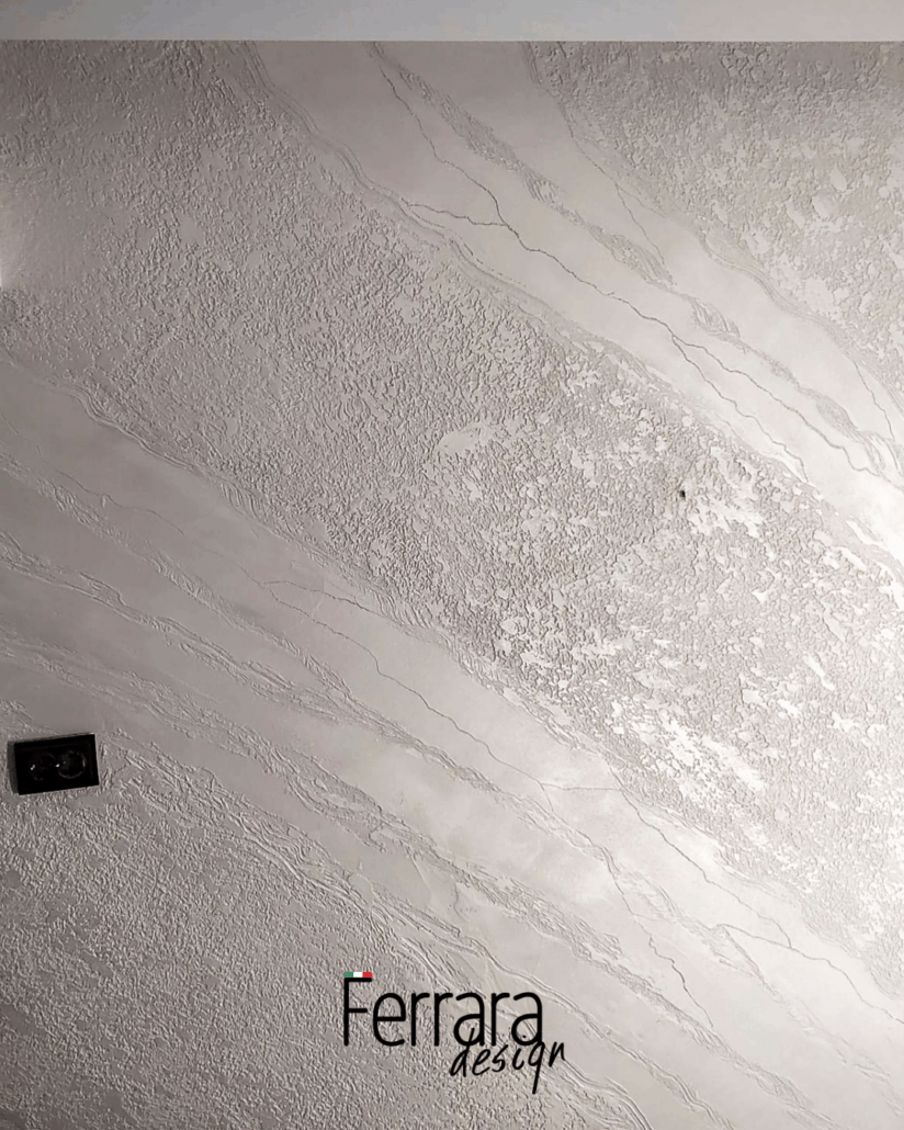 Textured white wall with 'Ferrara design' branding