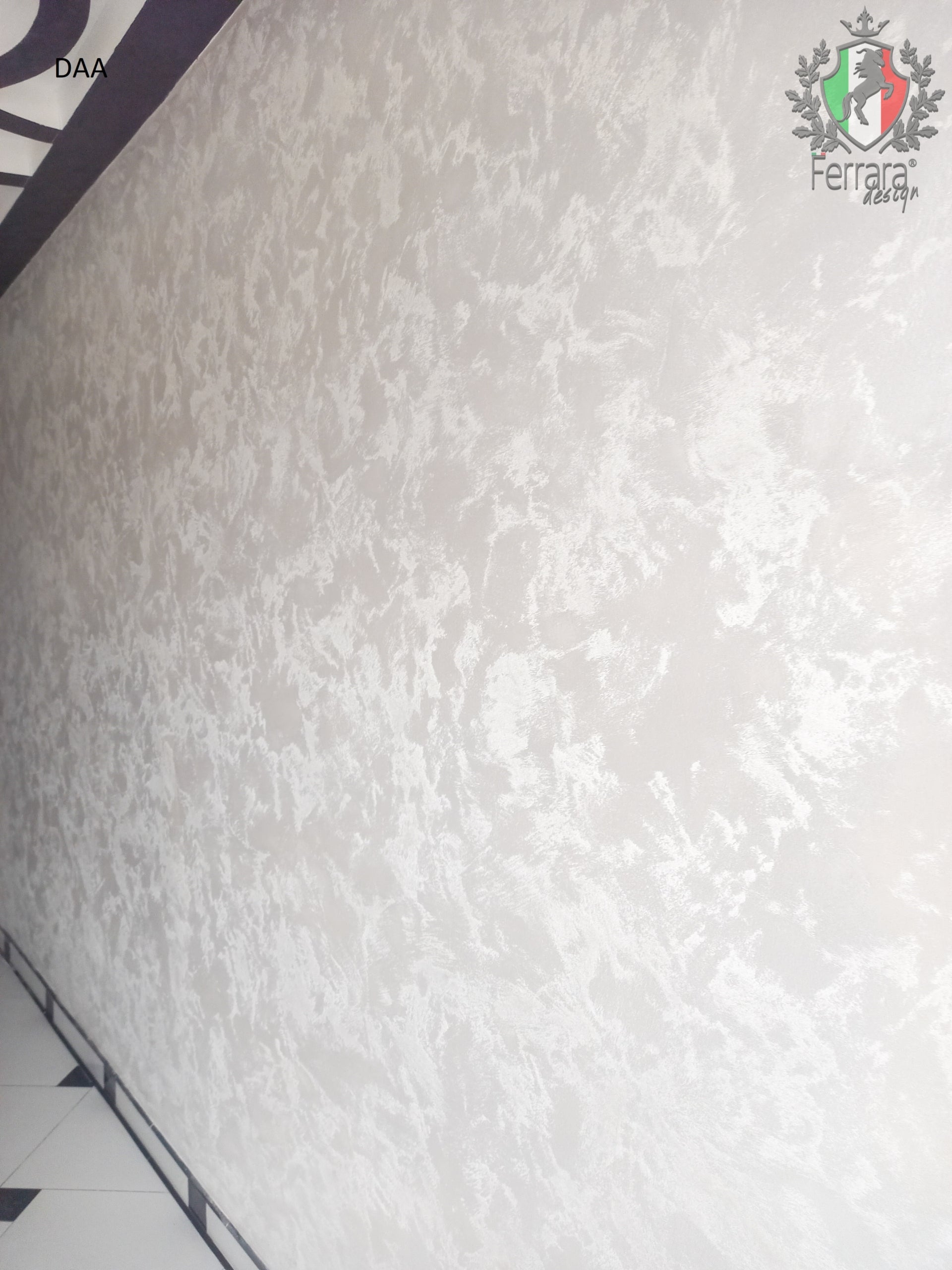 Close-up of white textured material with a brand logo in the corner.